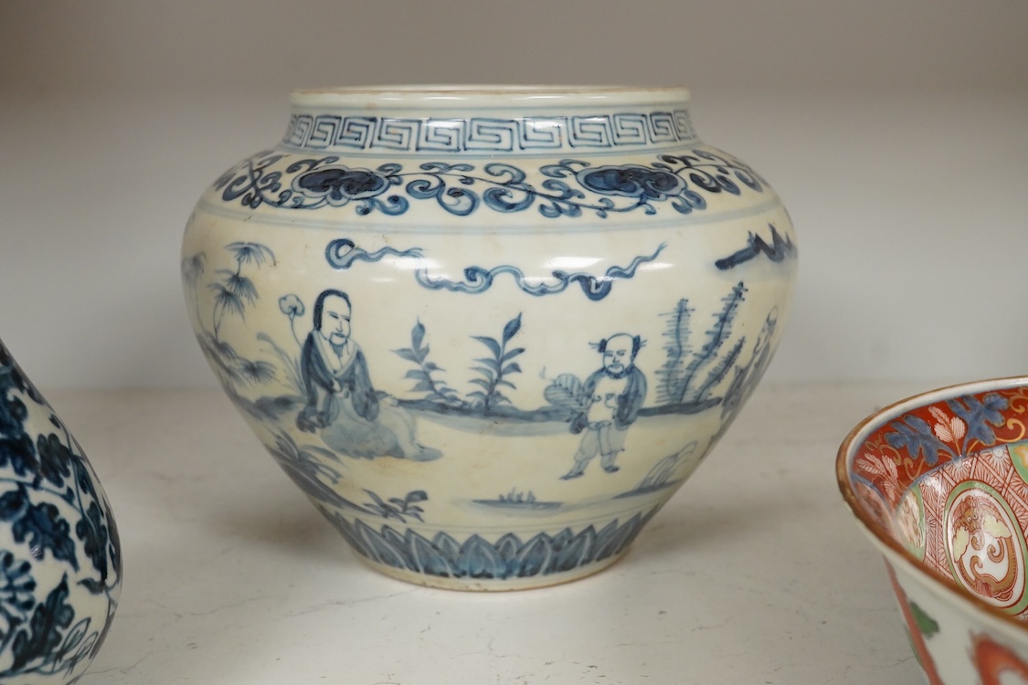 A pair of Chinese blue and white pear shaped vases, a similar jar and a Japanese bowl, largest 23cm in diameter